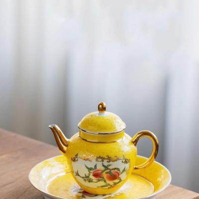 BỘ ẤM CHÉN QUẢ ĐÀO MEN VÀNG
